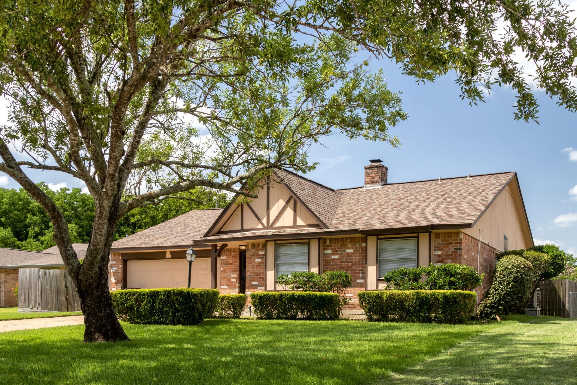 A cozy ranch home with a red brick exterior